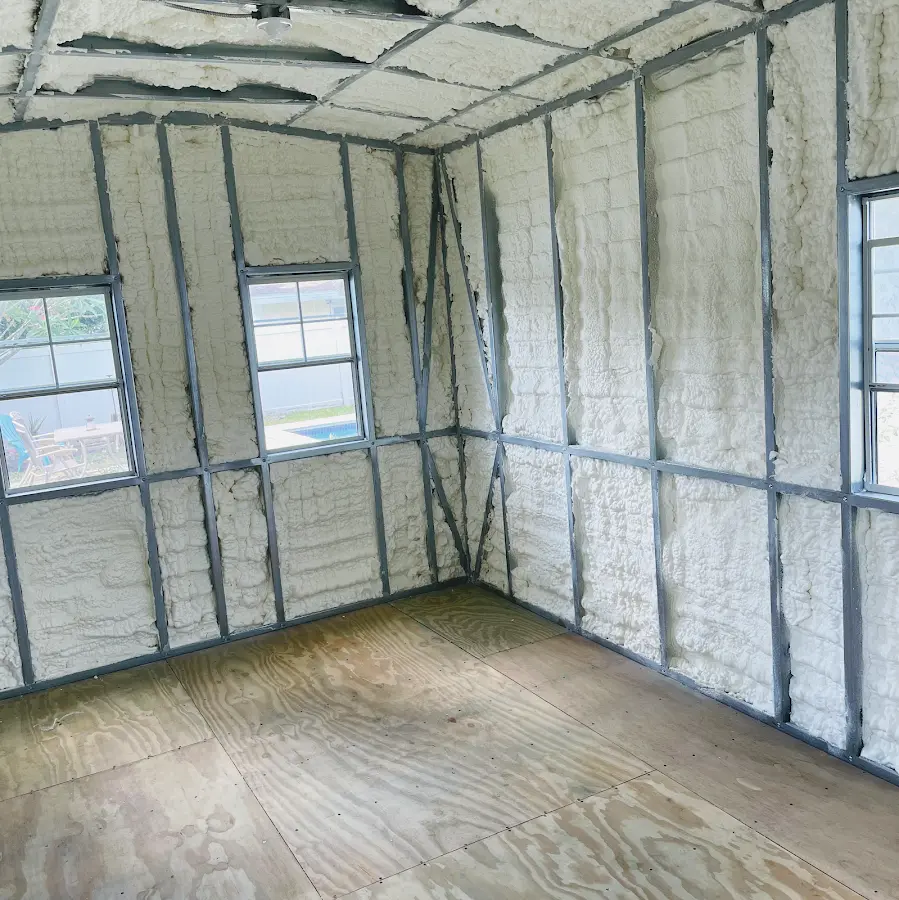 Closed-cell spray foam insulation applied to wall cavities in a residential project in Pelican Bay